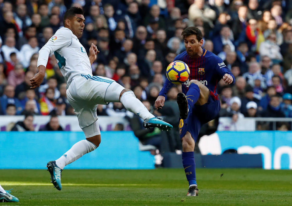 <p>Soccer Football – La Liga Santander – Real Madrid vs FC Barcelona – Santiago Bernabeu, Madrid, Spain – December 23, 2017 Barcelona’s Lionel Messi in action with Real Madrid’s Casemiro REUTERS/Juan Medina </p>