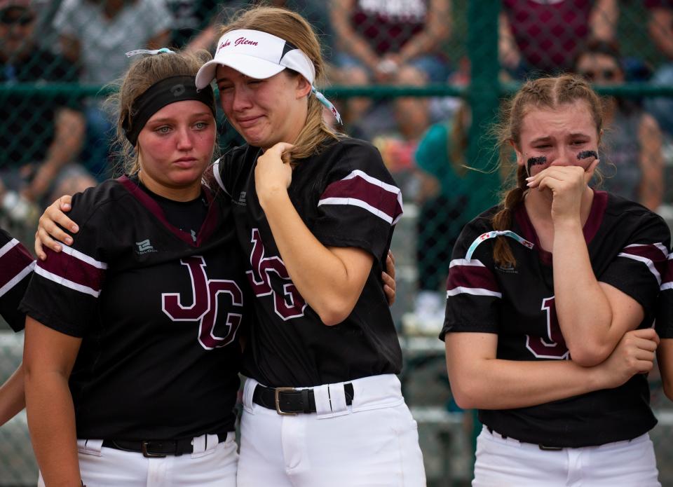 John Glenn players show their emotion after their loss against Heath during Division II Regional Final girls softball at Pickerington Central High School in Pickerington, Ohio on May 28, 2022. Heath clinched the victory over John Glenn 12-5.