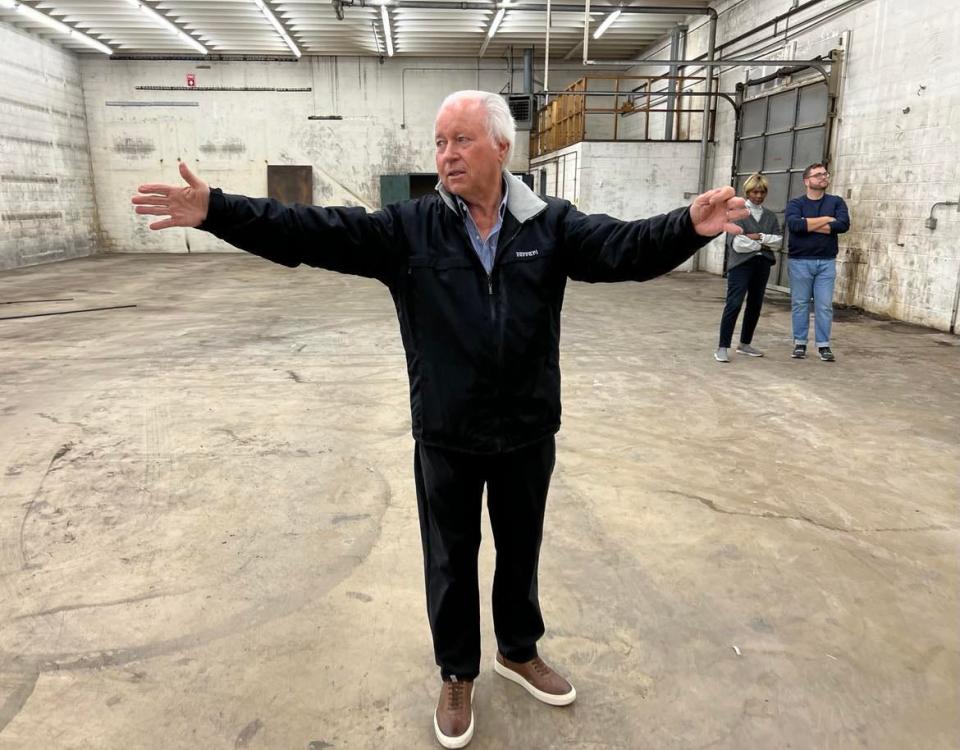 Ted Swaldo stands inside the former warehouse of the Ziegler Tire building in downtown Canton. The property will become the new home of the EN-RICH-MENT Fine Arts Academy. A fundraising campaign is being launched for the renovation and expansion project.