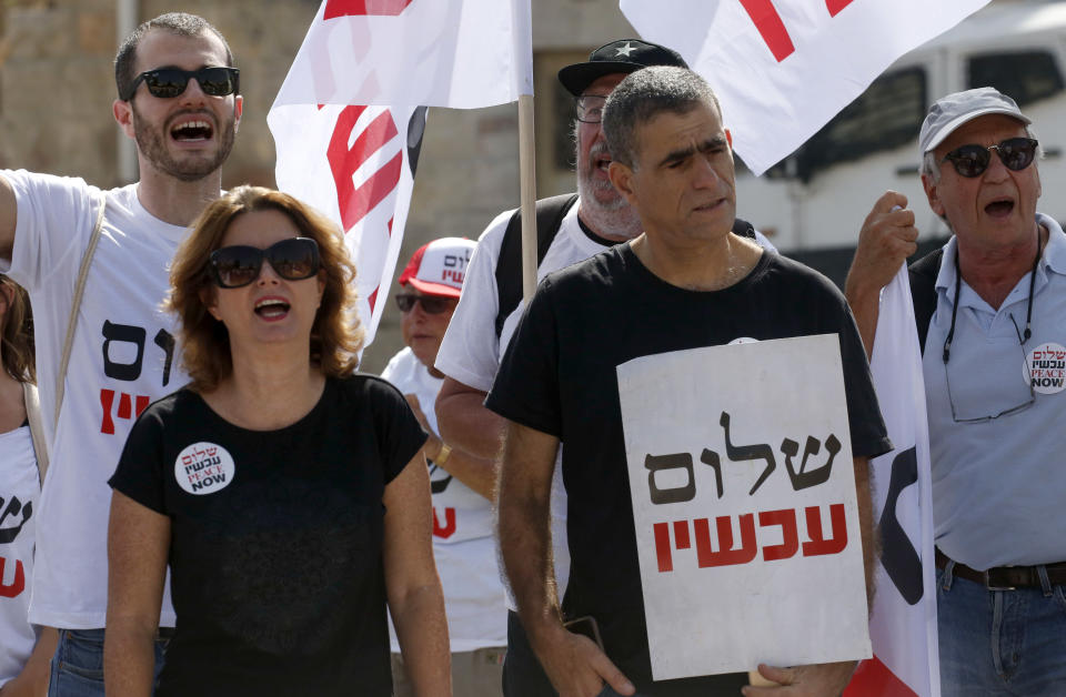 Israeli members of parliament Michal Rozin, left, and Mossi Raz, right, with demonstrators during a protest called by Israeli NGO Peace Now to denounce settlements in the Israeli-occupied West Bank on Oct. 20, 2017, in the divided city of Hebron. (Photo: Hazem Bader/AFP/Getty Images)