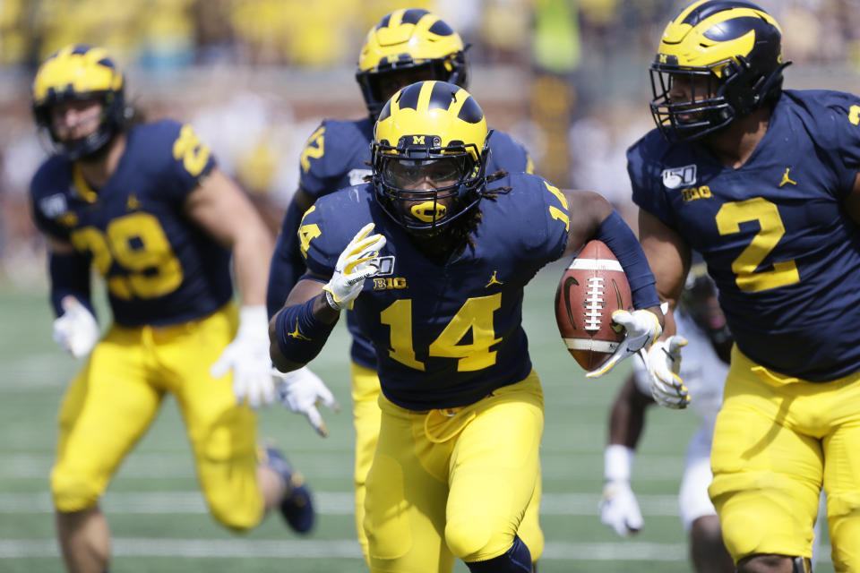 ANN ARBOR, MI - SEPTEMBER 7:  Josh Metellus #14 of the Michigan Wolverines carries the ball against the Army Black Knights during the first half at Michigan Stadium on September 7, 2019 in Ann Arbor, Michigan. (Photo by Duane Burleson/Getty Images)