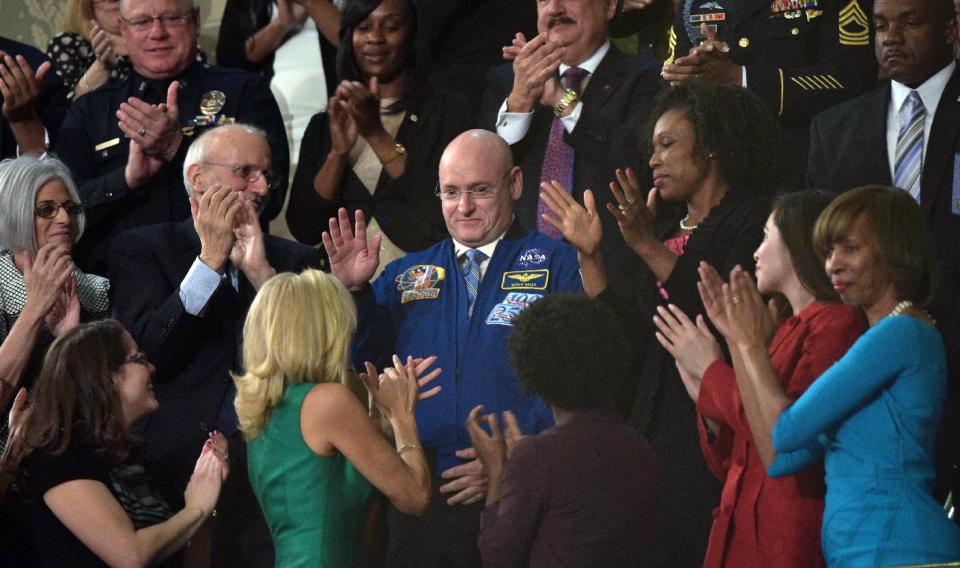 Astronaut Scott Kelly acknowledges applause as President Barack Obama delivers the State of the Union address before a joint session of Congress Tuesday, Jan. 20, 2015, on Capitol Hill in Washington. (AP Photo/Mandel Ngan, Pool)