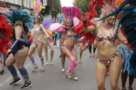 <p>Costumed revellers perform in the parade during the Notting Hill Carnival in London, Monday, Aug. 27, 2018. (Photo: Tim Ireland/AP) </p>