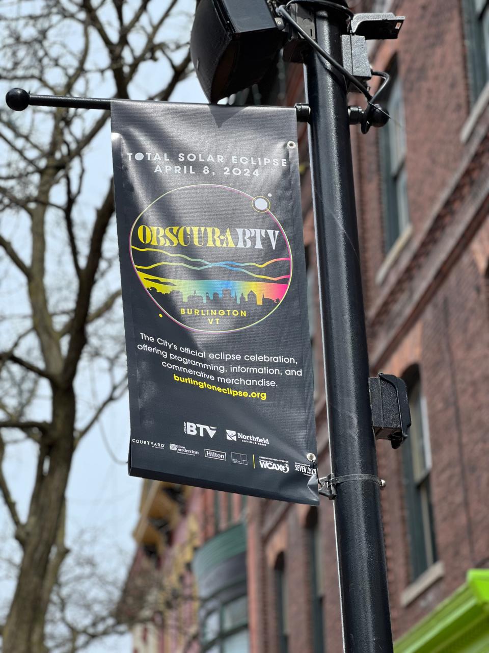 A sign on Church Street in Burlington on March 22, 2024 advertises the multi-day city-wide celebration of the solar eclipse - called Obscura BTV. A variety of activities and events will happen all across the city between April 6 and April 8 to coincide with Burlington being one of the cities to experience a total solar eclipse.