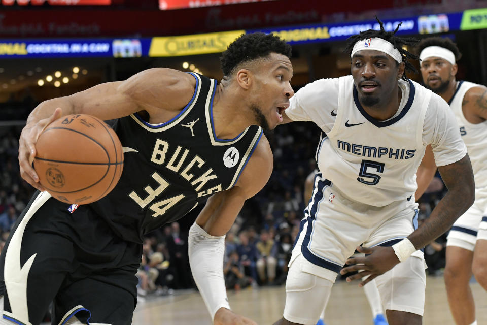 Milwaukee Bucks forward Giannis Antetokounmpo (34) drives against Memphis Grizzlies guard Vince Williams Jr. (5) in the first half of an NBA basketball game Thursday, Feb. 15, 2024, in Memphis, Tenn. (AP Photo/Brandon Dill)