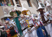 <p>Traditional carnival characters parade through the streets of Mittenwald, southern Germany, as the hot carnival season starts on Women’s Carnival, Feb. 23, 2017. (Photo: Angelika Warmuth/AFP/Getty Images) </p>