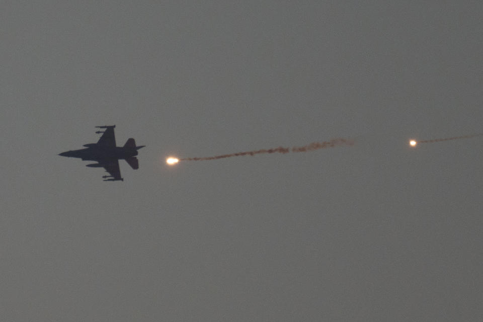 An Israeli fighter jet releases flares as it flies over the Gaza Strip, as seen from southern Israel, Tuesday, Jan. 16, 2024. (AP Photo/Leo Correa)