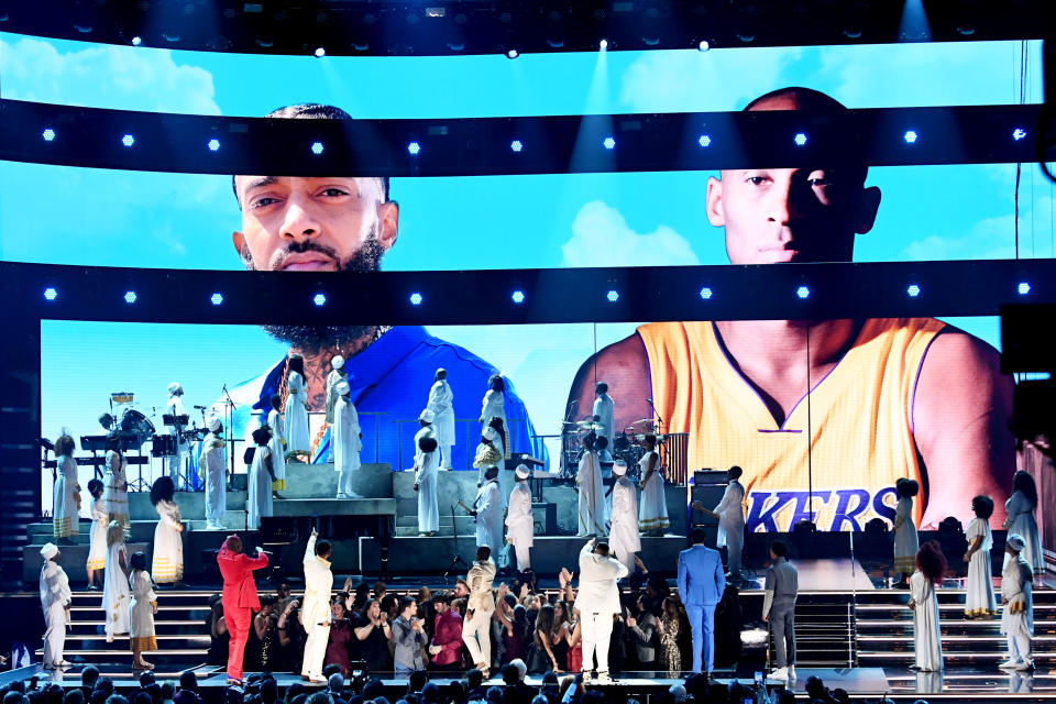 LOS ANGELES, CALIFORNIA - JANUARY 26: Images for the late Nipsey Hussle and Kobe Bryant are projected onto a screen while (L-R) YG, John Legend, Kirk Franklin, DJ Khaled, Meek Mill, and Roddy Ricch perform onstage during the 62nd Annual GRAMMY Awards at STAPLES Center on January 26, 2020 in Los Angeles, California. (Photo by Kevin Winter/Getty Images for The Recording Academy )