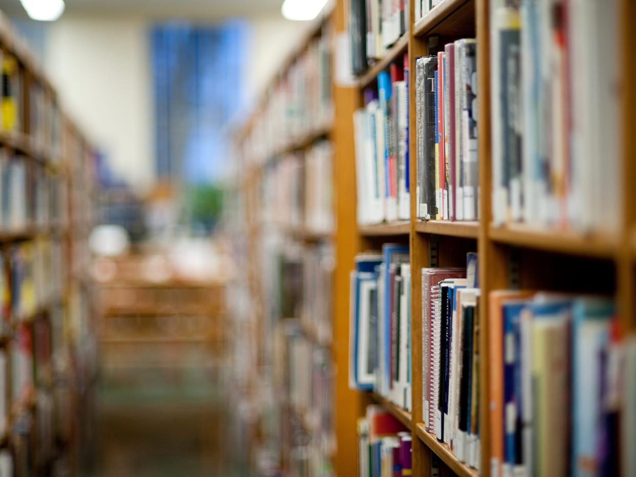 Books on shelf in library.