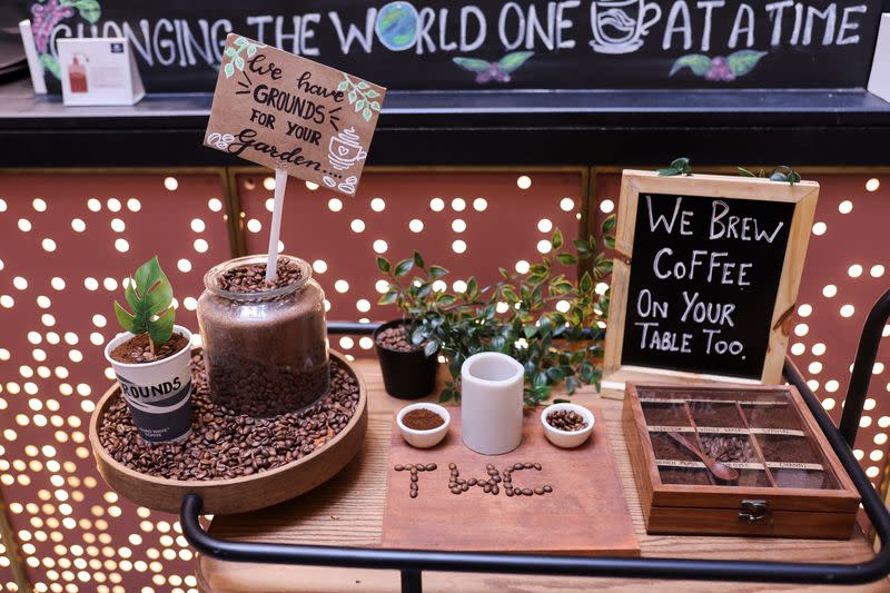 Coffee grounds and beans are seen at a counter of a Third Wave Coffee outlet at a market in New Delhi