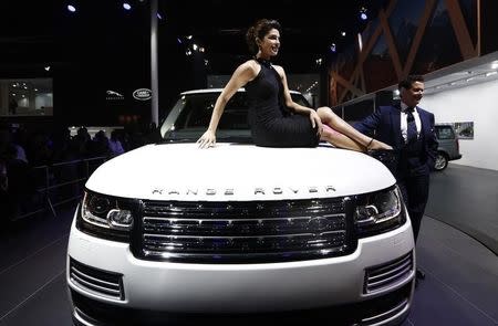 Bollywood actress Priyanka Chopra poses with Jaguar Land Rover's Range Rover LWB during its launch at the Indian Auto Expo in Greater Noida, on the outskirts of New Delhi, February 5, 2014. REUTERS/Adnan Abidi