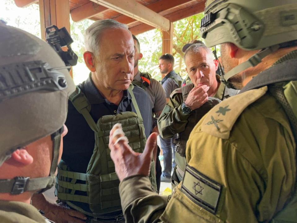 Israeli Prime Minister Benjamin Netanyahu visits Israeli soldiers as he inspects the soldiers deploying in Be’eri and Kfar Aza