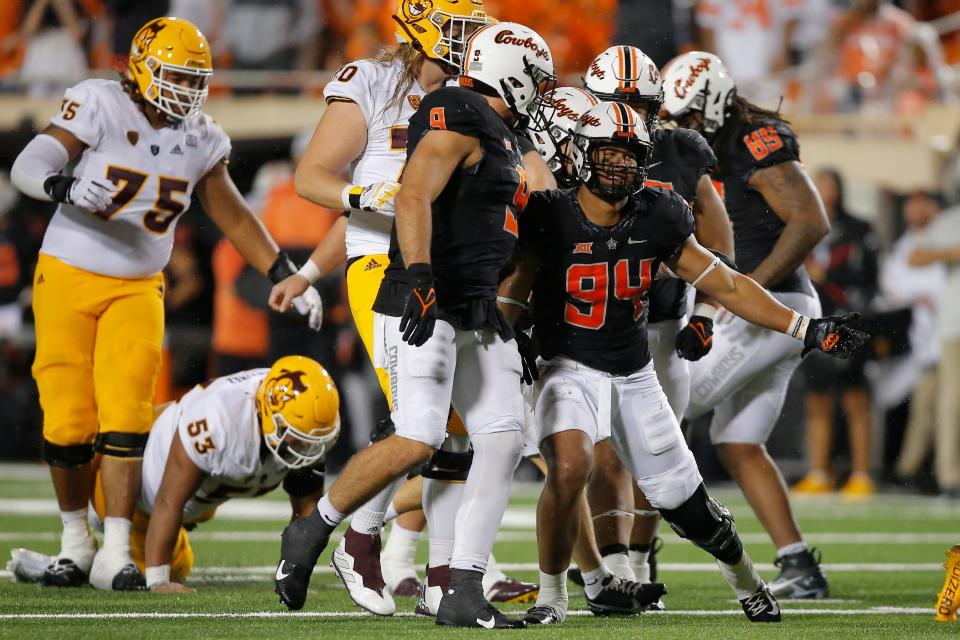 Oklahoma State's Trace Ford (94) celebrates beside Brock Martin (9) during a college football game between the Oklahoma State Cowboys (OSU) and the Arizona State Sun Devils at Boone Pickens Stadium in Stillwater, Okla., Saturday, Sept. 10, 2022. Oklahoma State won 34-17