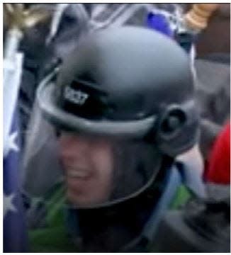 U.S. District Court for the District of Columbia court records show images of a man prosecutors say is Nicholas James Brockhoff of Covington at the U.S. Capitol wearing a helmet taken from a Metropolitan Police Department officer on Jan. 6, 2021.