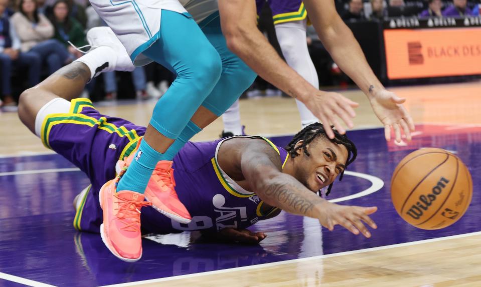 Utah Jazz forward Brice Sensabaugh (8) competes for the loose ball with Charlotte Hornets guard Seth Curry (30) in Salt Lake City on Thursday, Feb. 22, 2024. | Jeffrey D. Allred, Deseret News