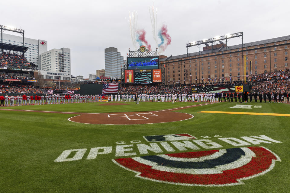 The national anthem is performed prior to the first inning of a baseball game between the Baltimore Orioles and the Los Angeles Angels, Thursday, March 28, 2024, in Baltimore. (AP Photo/Julia Nikhinson)