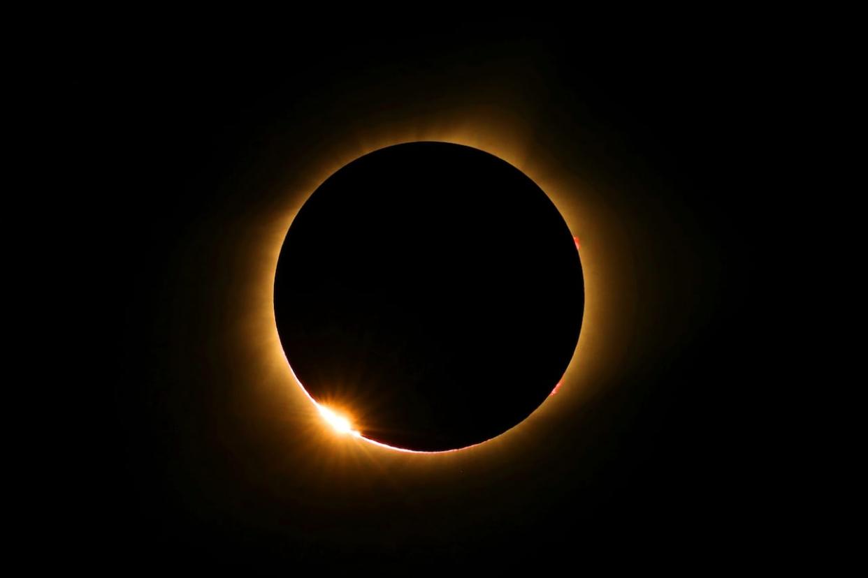 The moon passes in front of the sun for a total solar eclipse visible from Farmington, Mo., in August 2017. That's the last time there was a total solar eclipse. For people in the N.W.T., Monday's solar eclipse will appear as a partial eclipse.  (Anthony Souffle/Star Tribune/The Associated Press - image credit)