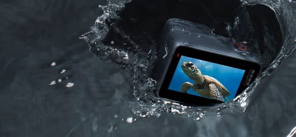 GoPro HERO7 camera partially underwater with a sea turtle on its display