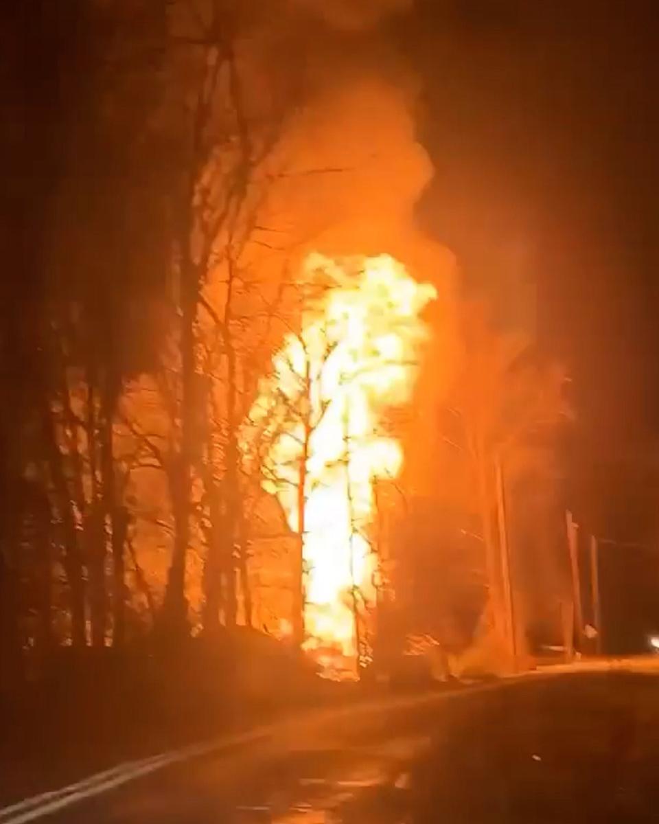 In a screen capture from a video, a propane tank explodes during a garage fire on the 100 block of Fish and Game Road, Friday, Dec. 22, 2023, in Oxford Township.