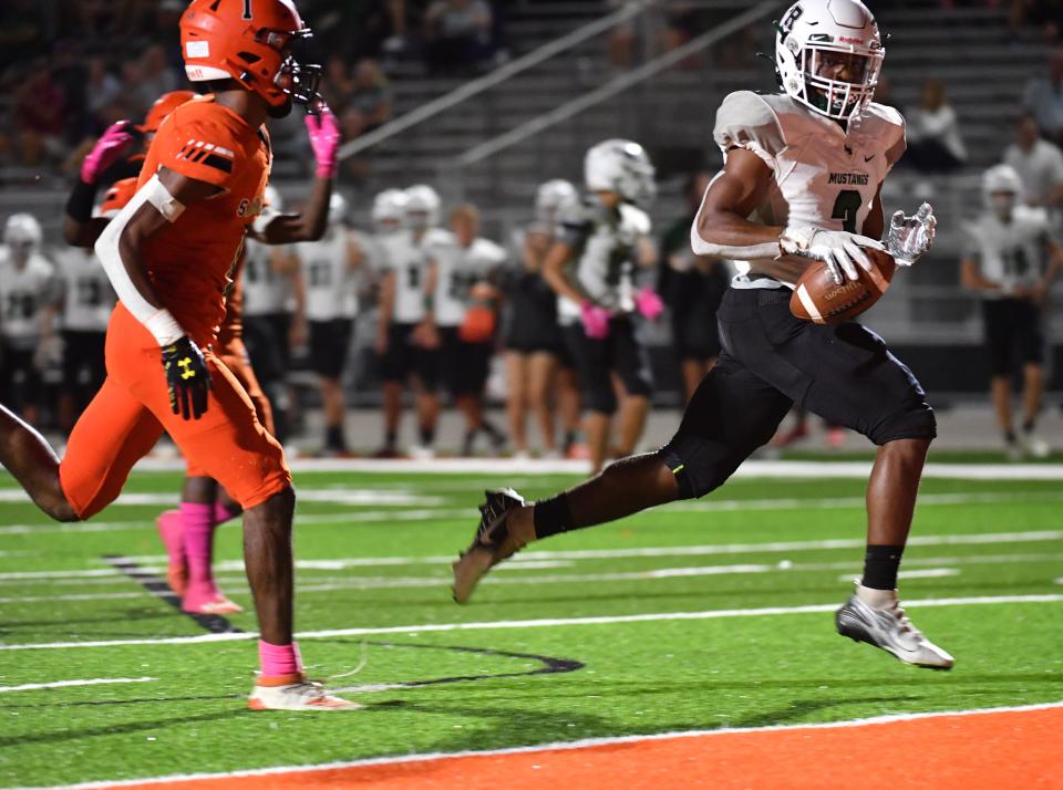 Lakewood Ranch running back Kevin Everhart (#3) is untouched by Sarasota defenders as he scores in the first half of last year's game.