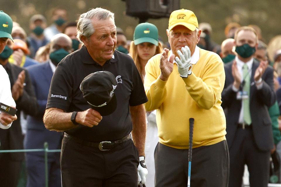 Gary Player doffs his cap as Jack Nicklaus applauds