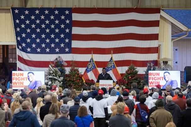 PHOTO: Republican Senate nominee Herschel Walker speaks to a crowd gathered for a rally with prominent Republicans on November 21, 2022 in Milton, Georgia. (Jessica Mcgowan/Getty Images)