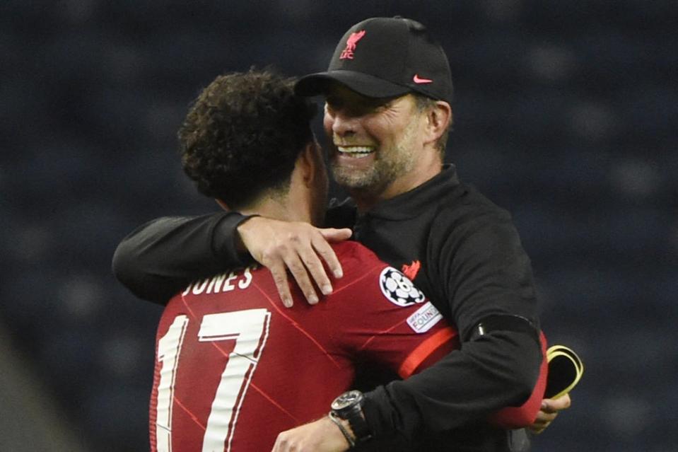 Jurgen Klopp embraces Curtis Jones after Liverpool’s big win over FC Porto  (AFP via Getty Images)