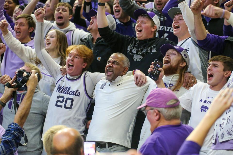 Jan 16, 2024; Manhattan, Kansas, USA; Kansas State Wildcats head coach Jerome Tang (center) celebrates with students following an overtime win against the Baylor Bears at Bramlage Coliseum. Mandatory Credit: Scott Sewell-USA TODAY Sports