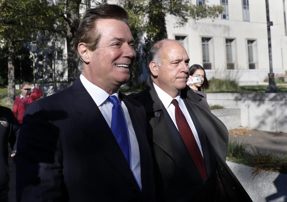 Paul Manafort, left, leaves Federal District Court in Washington on Monday. (Photo: Alex Brandon/AP)