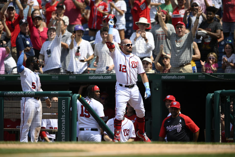 Washington Nationals' Kyle Schwarber takes a curtain call after he hit a two-run home run during the seventh inning of a baseball game against the New York Mets, Sunday, June 20, 2021, in Washington. (AP Photo/Nick Wass)