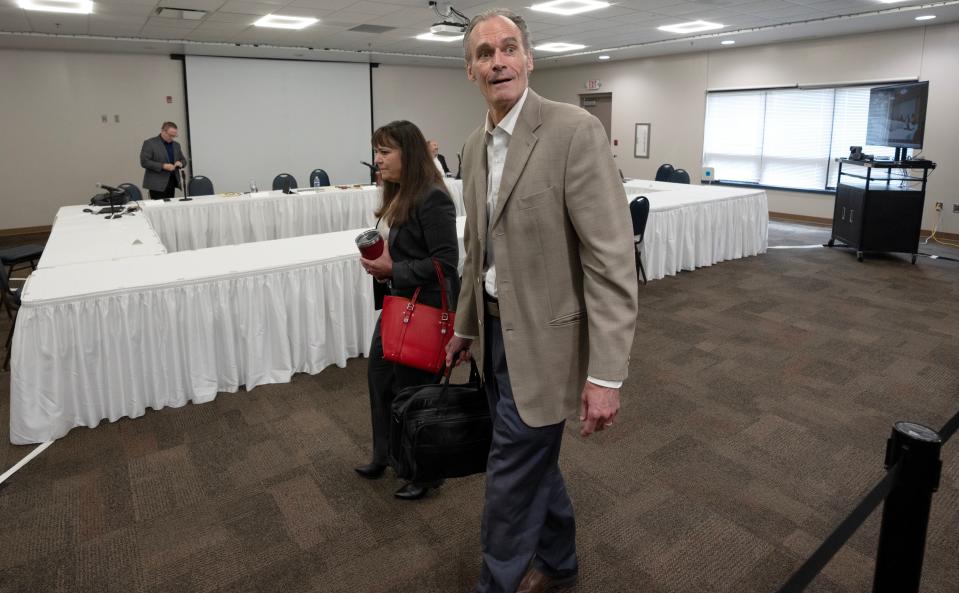 Fired UW-La Crosse Chancellor Joe Gow and his wife, Carman Wilson, leave a disciplinary hearing to decide whether he should be fired as a faculty member from the University of Wisconsin-La Crosse on Thursday in Onalaska.