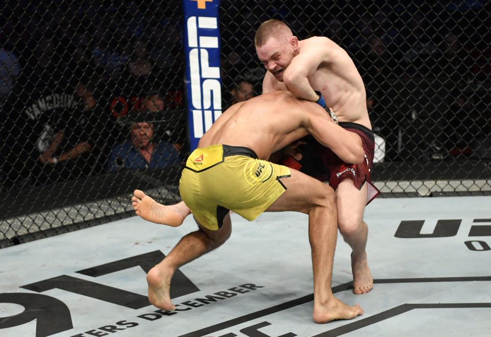 VANCOUVER, BRITISH COLUMBIA - SEPTEMBER 14:  (R-L) Tristan Connelly of Canada attempts to secure a guillotine choke submission against Michel Pereira of Brazil in their middleweight bout during the UFC Fight Night event at Rogers Arena on September 14, 2019 in Vancouver, Canada. (Photo by Jeff Bottari/Zuffa LLC/Zuffa LLC)