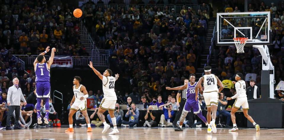 Kansas State’s Markquis Nowell hits a three-point basket in the second half of an NCAA college basketball game against Wichita State, Sunday, Dec. 5, 2021, in Wichita, Kan. (Travis Heying/The Wichita Eagle via AP)
