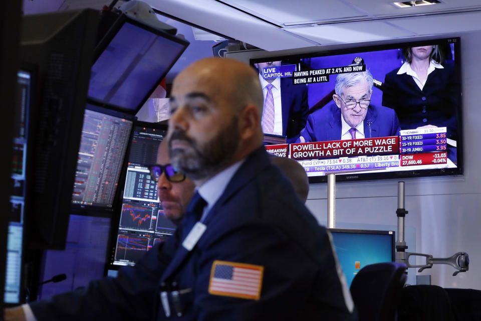 A television screen on the floor of the New York Stock Exchange shows Federal Reserve Chair Jerome Powell testifying in Washington, Wednesday, Nov. 13, 2019. (AP Photo/Richard Drew)