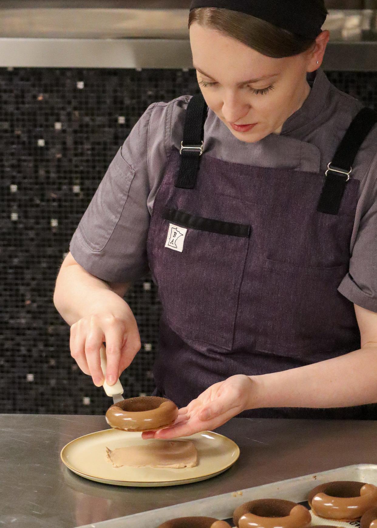 Executive pastry chef Noelle Marchetti plates the Nocciola dessert at Yolan at The Joseph, a Luxury Collection Hotel, in Nashville.