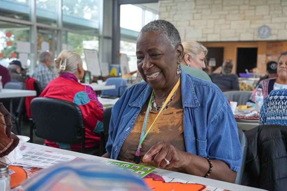 Community activist Patricia King plays bingo during a Meals on Wheels event at the Travis County Community Center at Del Valle on Nov. 16. King organizes weekly events at the community center to feed Del Valle residents and create opportunities to socialize.