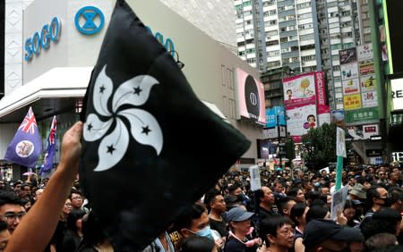 People march during a rally to demand democracy and political reforms in Hong Kong