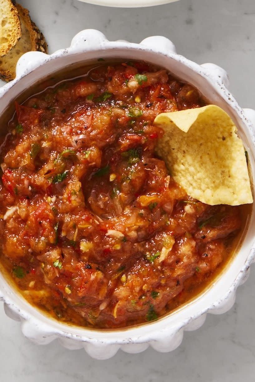<p>While salsa is often the go-to pre-meal snacking option, this recipe outshines its store-bought equivalents with a unique, smokey taste.</p><p><em><a href="https://www.goodhousekeeping.com/food-recipes/party-ideas/a28507963/charred-salsa-recipe/" rel="nofollow noopener" target="_blank" data-ylk="slk:Get the recipe for Charred Salsa »;elm:context_link;itc:0;sec:content-canvas" class="link ">Get the recipe for Charred Salsa »</a></em></p><p><strong>RELATED:</strong> <a href="https://www.goodhousekeeping.com/preview/eyJpZCI6ImY2M2FjNGViLTYzN2ItNGU0Yi04NzkzLWQwMDU0NmFjZjI3ZCIsInR5cGUiOiJjb250ZW50IiwidmVyc2lvbiI6MCwidmVyc2lvbmVkIjpmYWxzZSwidmVyc2lvbl9jcmVhdGVkX2F0IjoiIn0=/" rel="nofollow noopener" target="_blank" data-ylk="slk:The Ultimate Guide to Grilling;elm:context_link;itc:0;sec:content-canvas" class="link ">The Ultimate Guide to Grilling</a></p>
