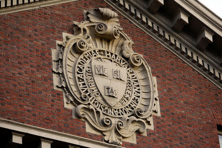 FILE PHOTO: A seal hangs over a building at Harvard University in Cambridge, Massachusetts, U.S., November 16, 2012. REUTERS/Jessica Rinaldi/File Photo