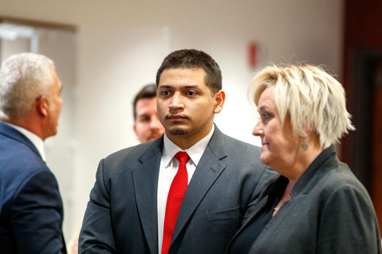 Jose Larin-Garcia stands as the jury arrives for closing arguments in his murder trial Wednesday in Indio.