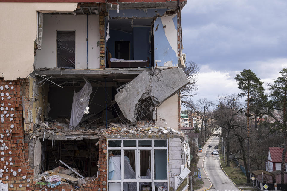 A view of a building damaged by shelling in Irpin, in the outskirts of Kyiv, Ukraine, Monday, April 11, 2022. (AP Photo/Evgeniy Maloletka)