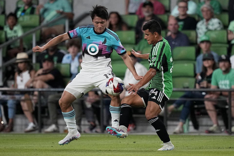 Minnesota United midfielder Sang Bin Jeong (11) and Austin FC defender Nick Lima (24) compete for control of the ball during the second half of an MLS soccer match Wednesday, May 31, 2023, in Austin, Texas. (AP Photo/Eric Gay)