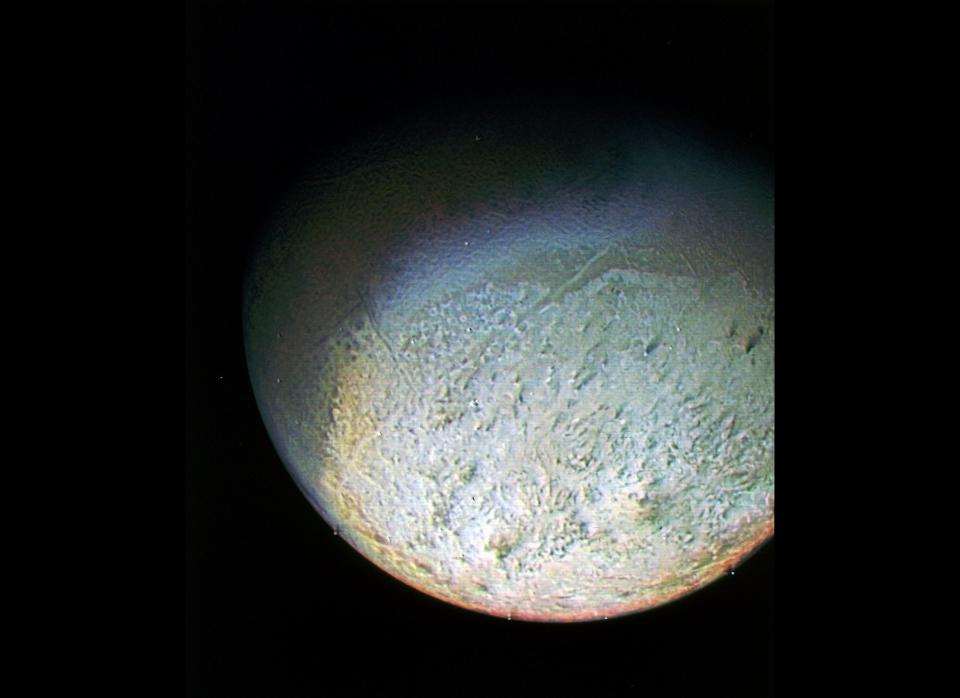 This photo, taken by NASA through green, violet and ultraviolet filters, shows the bright southern hemisphere of Triton. Triton is named after the Greek sea god Triton, the son of Poseidon (the Greek god comparable to the Roman Neptune). Triton is the only Neptune moon that has an internal geology; it is known to have geological activity like geysers and volcanic activity. It is one of very few such moons in the solar system. Experts believe that Triton could have been a captured object from the nearby <a href="http://www.nature.com/nature/journal/v362/n6422/abs/362730a0.html" target="_hplink">Kuiper Belt</a>, where the dwarf planet <a href="http://www.mnn.com/eco-glossary/pluto" target="_hplink">Pluto</a> and other objects reside. Triton is the largest of Neptune's moons and the only object that orbits any planet in a retrograde orbit. Just like our own moon, it is locked in a <a href="http://solarsystem.nasa.gov/planets/profile.cfm?Object=Triton" target="_hplink">synchronous rotation</a> with its home planet.