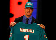 NEW YORK, NY - APRIL 26: Ryan Tannehill from Texas A&M holds up a jersey as he stands on stage after he was selected #8 overall by the Miami Dolphins in the first round of during the 2012 NFL Draft at Radio City Music Hall on April 26, 2012 in New York City. (Photo by Al Bello/Getty Images)