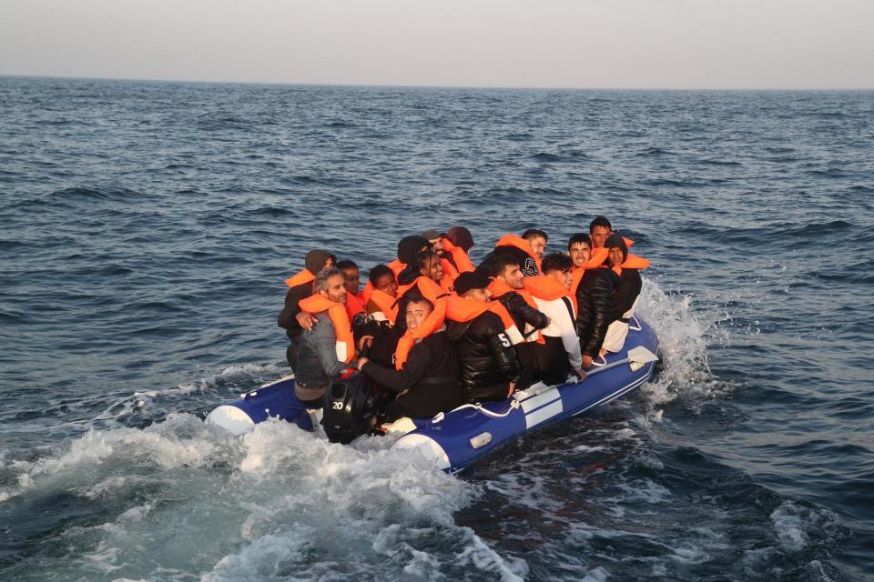 A group of people thought to be migrants crossing The Channel in a small boat headed in the direction of Dover, Kent (PA)