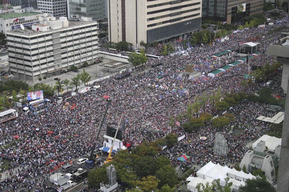 In this Thursday, Oct. 3, 2019 photo, thousands gather in downtown Seoul during a rally against South Korea's Justice Minister Cho Kuk in Seoul, South Korea. (Kim Seung-doo/Yonhap via AP)