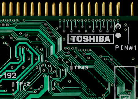 A logo of Toshiba Corp is seen on a printed circuit board in this photo illustration taken in Tokyo July 31, 2012. REUTERS/Yuriko Nakao/Files