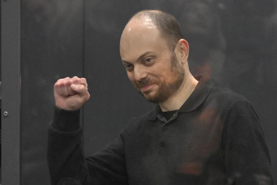 FILE - Russian opposition activist Vladimir Kara-Murza gestures while standing in a glass cage in a courtroom during the announcement of the verdict on appeal at the Moscow City Court on July 31, 2023. Kara-Murza was convicted of treason last year over a speech denouncing the war in Ukraine. He is serving a 25-year prison term in a Siberian prison colony, the stiffest sentence for a Kremlin critic in modern Russia. (AP Photo, File)