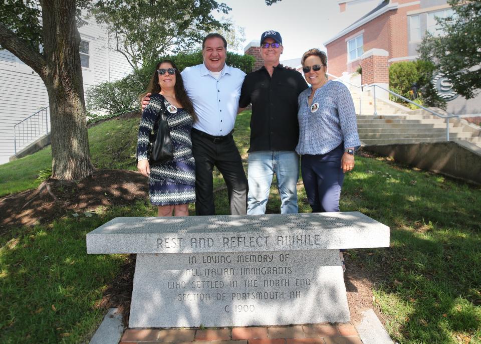 Members of the Portsmouth 400th anniversary group and the organizers of the Little Italy Carnival, from left, are Robyn Aldo, Massimo Morgia, Trevor Bartlett and Dawn Przychodzien. They are seen at a bench honoring the city's Italian families who lost their homes during urban renewal in the 1960s.