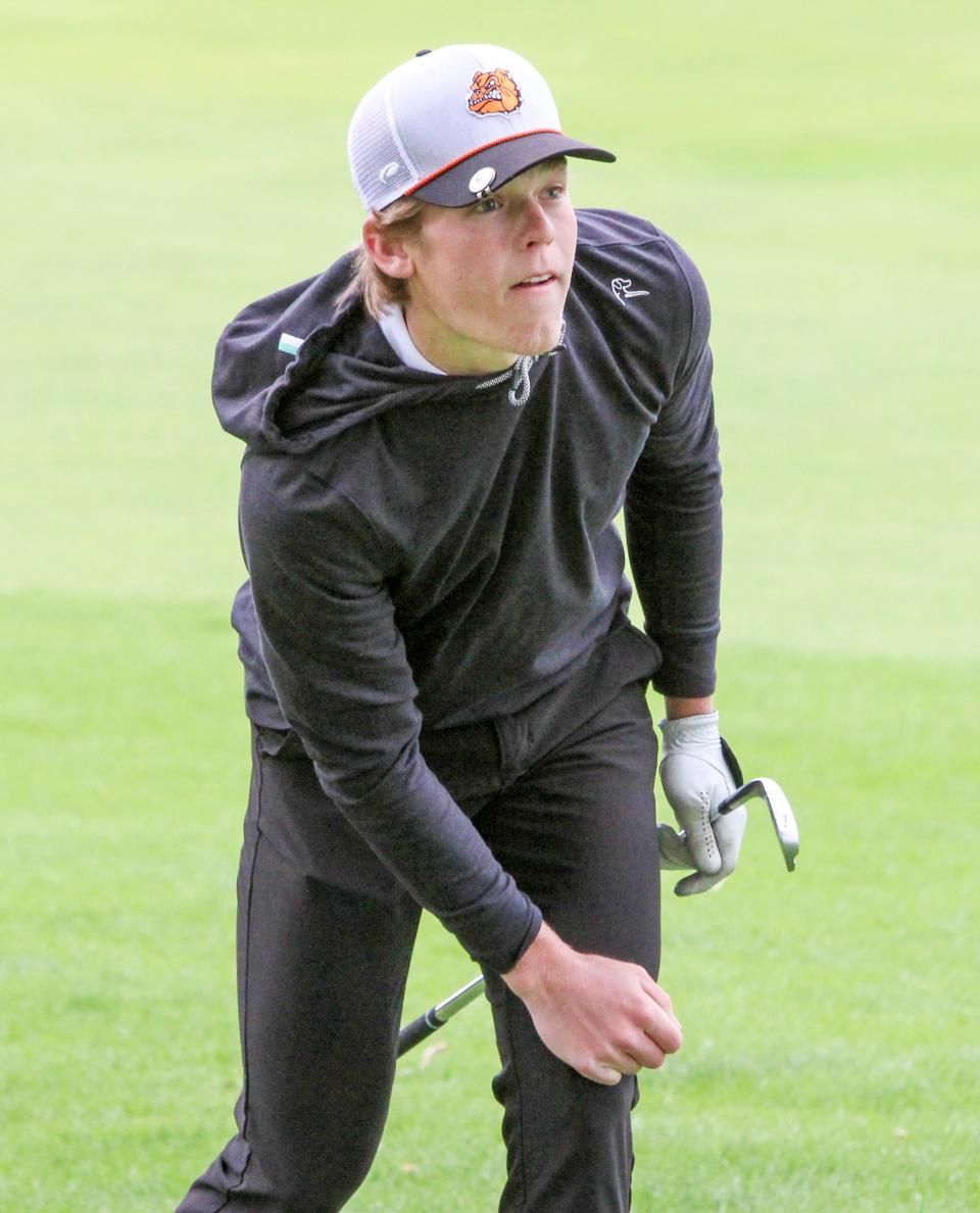 Brighton's Winston Lerch watches an approach shot land within six feet of the cup during the KLAA preseason golf tournament Thursday, April 20, 2023 at Kensington Metropark Golf Course.